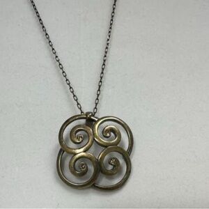 LAST ONE!

Touchstone Crystal/Swarovski, antique gold color Swirl Necklace.